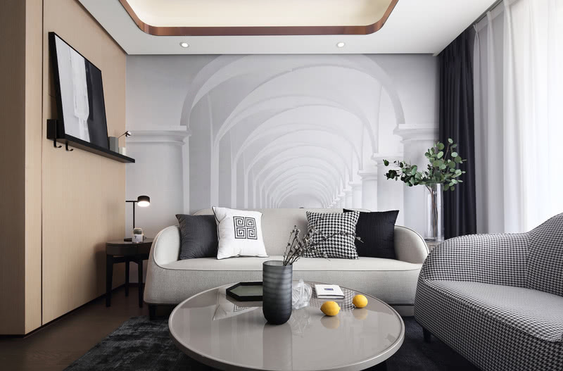 客厅的米白色三人沙发恬静沉稳，百看不厌；搭上千鸟格的单人沙发，极具艺术立体美感，整体感觉舒适，古朴自然。沙发背景墙定制了3D壁纸，在视觉上增加了空间的立体感。