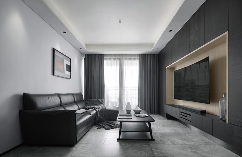 ▲客厅整体黑色系列电视柜，凹凸造型强化空间感。
