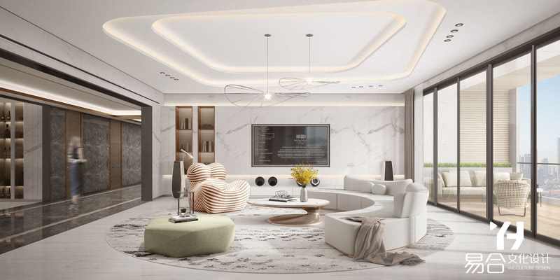 客厅素雅的色调简洁大方，鱼肚白电视背景墙，圆形地毯以及曲形沙发，营造出一个舒适自然的空间感。