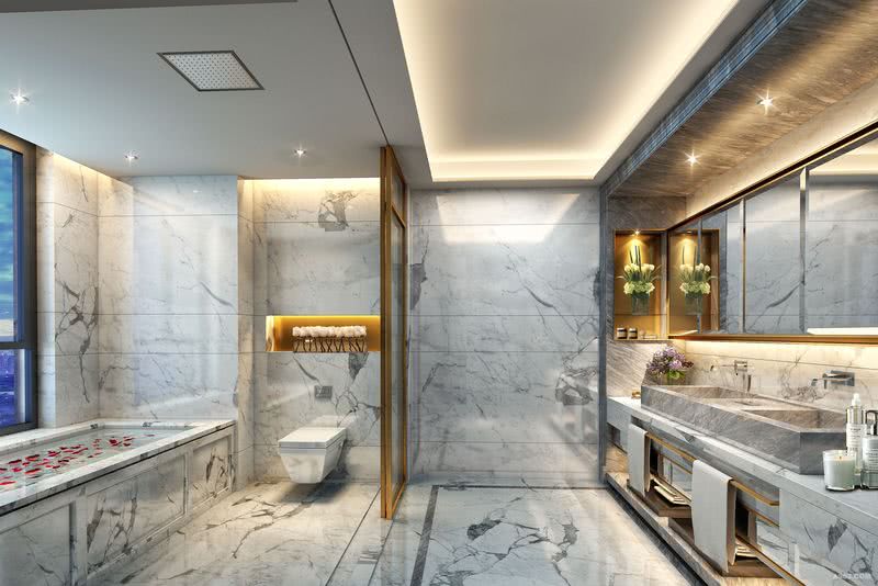       浴室的地台和墙身均选用暖灰纹理石，一排清镜以香槟金线条框边，不经意间流露细腻独特的设计心思，整体看上去十分的具有空间感与通透性，缔造雅致现代的沐浴空间。 